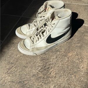 Nike White High-Top Sneakers with Black Swoosh